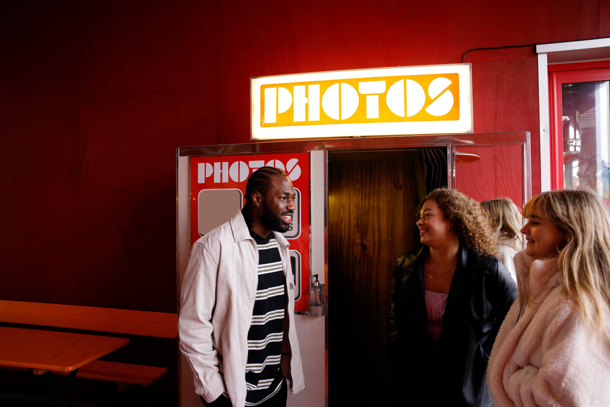 Friends having fun at a photo booth